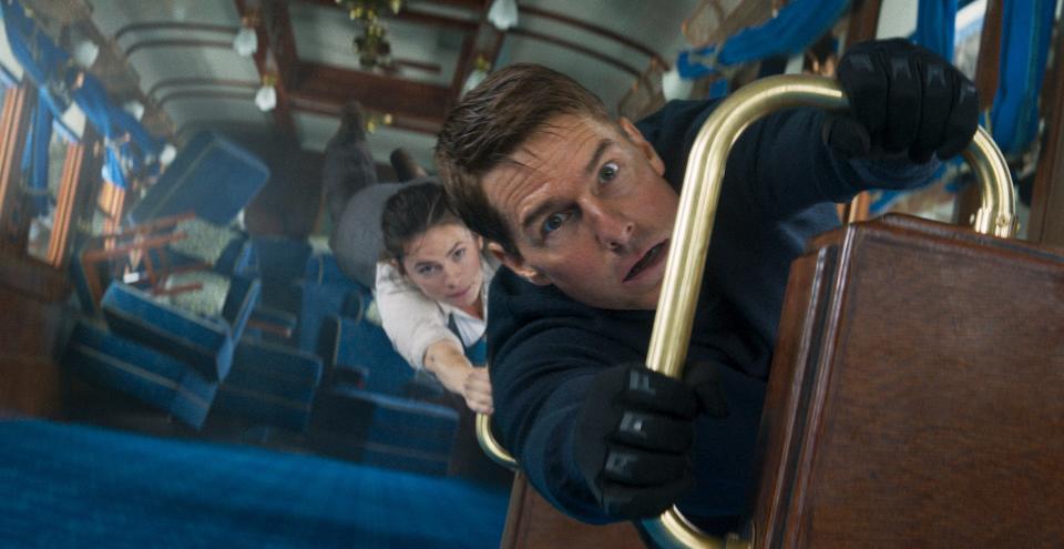 Secret agent Ethan Hunt (Tom Cruise) and the mysterious thief Grace (Hayley Atwell) try to survive a trip on the Orient Express in the action movie "Mission: Impossible – Dead Reckoning Part One."