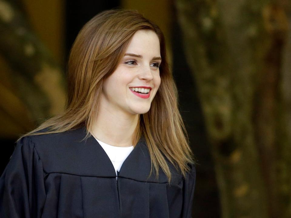 Emma Watson at her graduation from Brown University wearing a black graduation robe