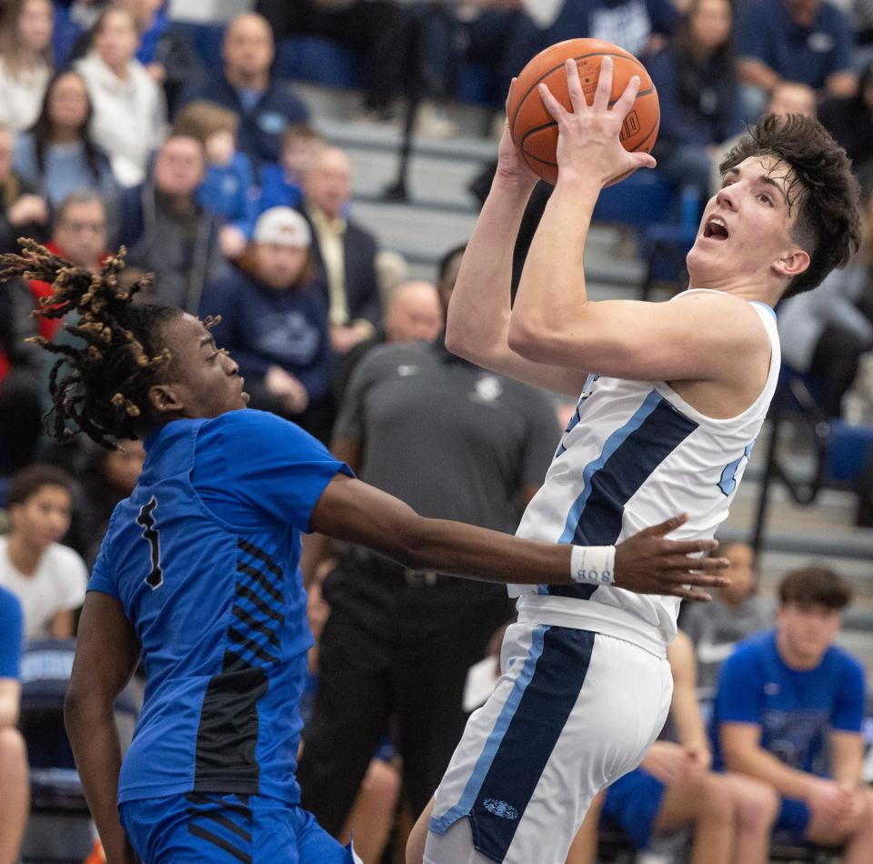 Louisville's Hayden Nigro looks to get to the rim as CVCA's LaVelle Sharpe Jr. defends, Tuesday, Jan. 16, 2024.