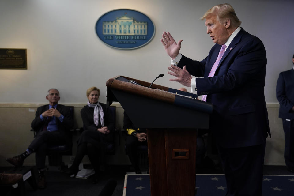 FILE - In this April 10, 2020, file photo President Donald Trump speaks during a coronavirus task force briefing at the White House. Director of the National Institute of Allergy and Infectious Diseases Dr. Anthony Fauci, left, and White House coronavirus response coordinator Dr. Deborah Birx, second from left, listen. (AP Photo/Evan Vucci, File)