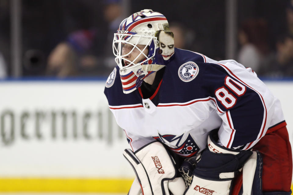 THIS CORRECTS THAT KIVLENIEKS DIED OF CHEST TRAUMA FROM AN ERRANT FIREWORKS MORTAR BLAST AND NOT A SUBSEQUENT FALL AS AUTHORITIES PREVIOUSLY REPORTED - FILE - Columbus Blue Jackets goaltender Matiss Kivlenieks (80) is shown during the second period of an NHL hockey game in New York, in this Sunday, Jan. 19, 2020, file photo. The Columbus Blue Jackets and Latvian Hockey Federation said Monday, July 5, 2021, that 24-year-old goaltender Matiss Kivlenieks has died. A medical examiner in Michigan says an autopsy has determined that Columbus Blue Jackets goaltender Matiss Kivlenieks died of chest trauma from an errant fireworks mortar blast, and not a fall as authorities previously reported. Police in Novi, Michigan, said the mortar-style firework tilted slightly and started to fire toward people nearby Sunday night, July 4. (AP Photo/Kathy Willens, File)
