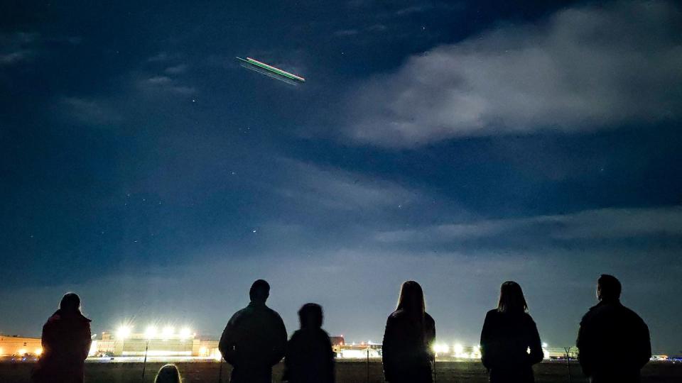 An F-35A passes overhead as family members gather near the Hill Air Force Base flight line in February 2022 to watch the early morning departure of the 34th Fighter Squadron and its fighter generation squadron. (Micah Garbarino/Air Force)