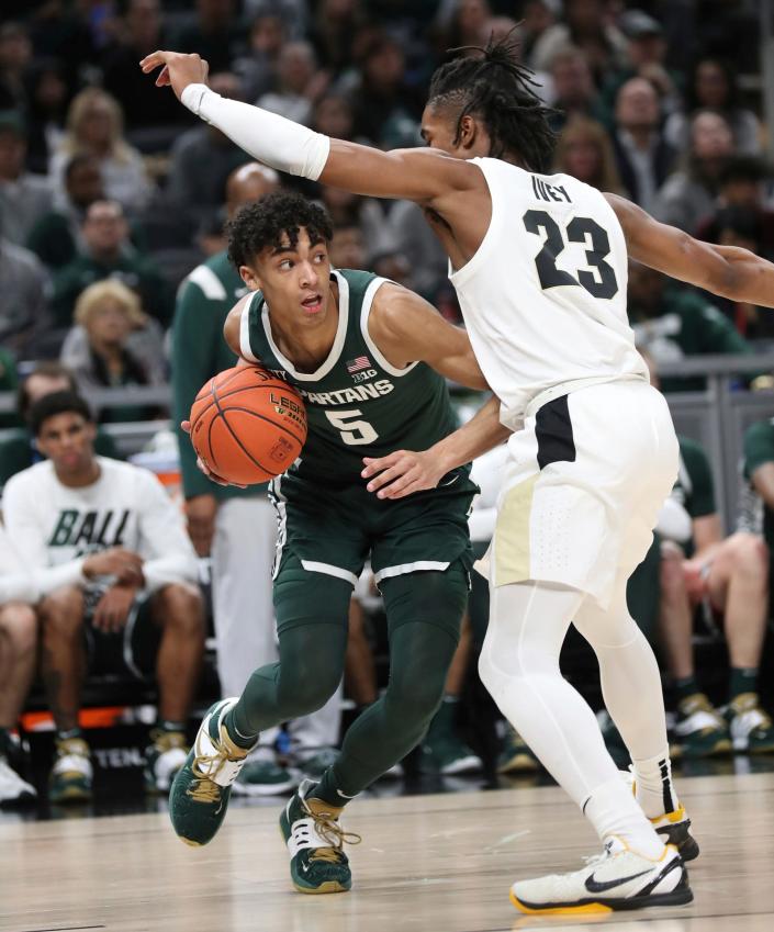 Michigan State guard Max Christie drives against Purdue guard Jaden Ivey during the second half of MSU's 75-70 loss in the Big Ten tournament semifinal on Saturday, March 12, 2022, in Indianapolis.