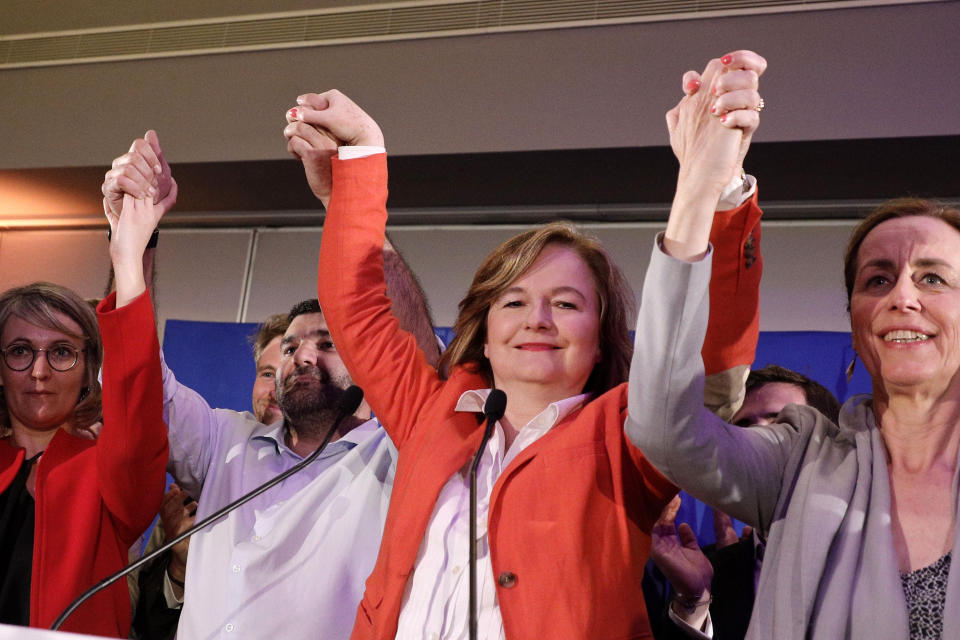 Nathalie Loiseau, center, head of French president Emmanuel Macron's party list, reacts at the campaign headquarters, Sunday, May 26, 2019 in Paris. Exit polls in France indicated that Marine Le Pen's far-right National Rally party came out on top, in an astounding rebuke for French President Emmanuel Macron, who has made EU integration the heart of his presidency. (AP Photo/Kamil Zihnioglu)