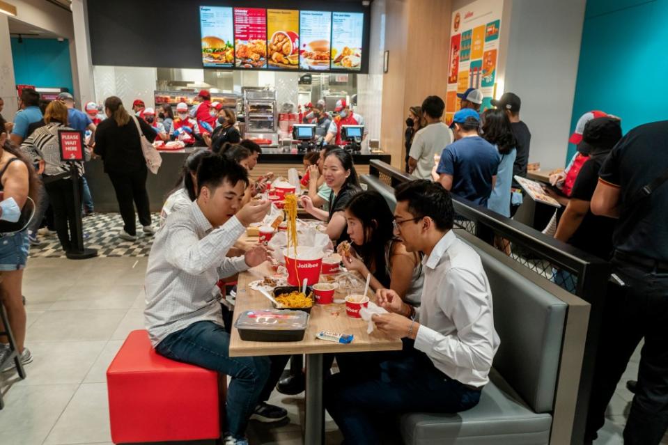 Chicken Joy lovers flock to the Grand Opening of the Jollibee fast food restaurant in Times Square in New York on Thursday, August 18, 2022 . The restaurant chain, which has been dubbed the Philippine McDonald's because of its ubiquity and popularity in the country, opened its Times Square store. Jollibee Foods Corp., has 65 stores in the US with this being the fourth in New York. (Photo by Richard B. Levine)No Use Germany.