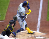 Milwaukee Brewers' Rhys Hoskins is hit by a pitch from Pittsburgh Pirates relief pitcher Luis L. Ortiz, with bases loaded, forcing in a run during the third inning of a baseball game in Pittsburgh, Wednesday, April 24, 2024. (AP Photo/Gene J. Puskar)