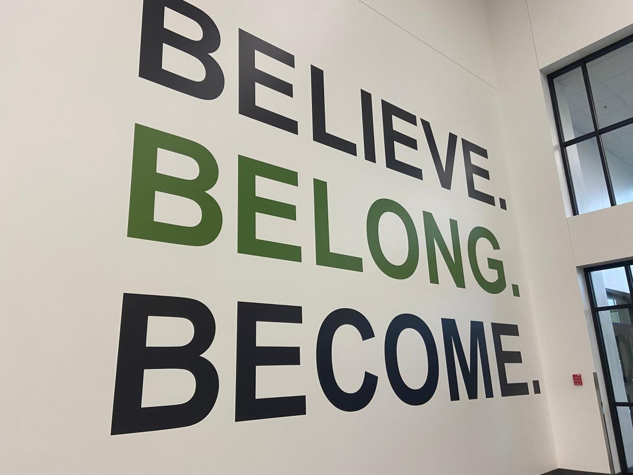 Peak Innovation's motto on their front entry wall, "Believe. Belong. Become."