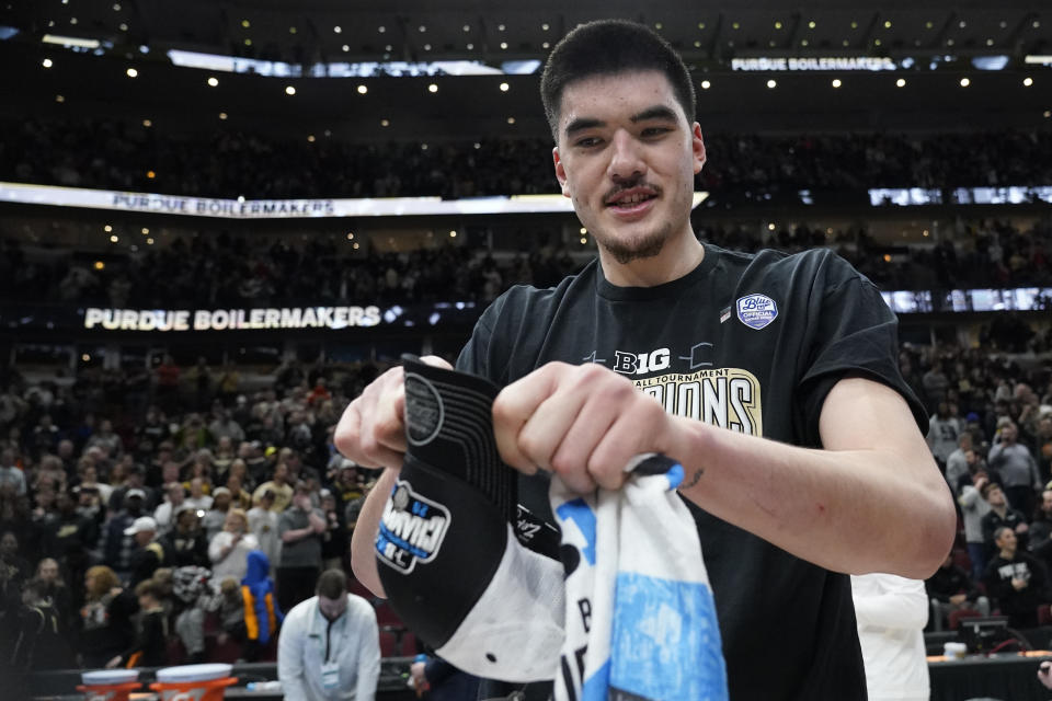 CORRECTS TO SUNDAY, MARCH 12, 2023, NOT SATURDAY, MARCH 11, 2023 - Purdue's Zach Edey celebrates his team's 67-65 win over Penn State for the Big Ten tournament championship in an NCAA college basketball game Sunday, March 12, 2023, in Chicago. (AP Photo/Nam Y. Huh)