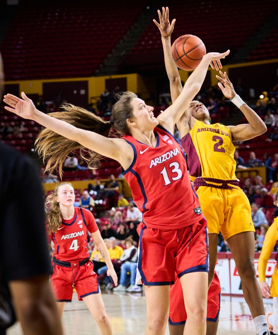 Jan 22, 2023; Tempe, AZ, USA; Arizona State Sun Devils guard Jaddan Simmons (2) shoots while being guarded by Arizona Wildcats guard Helena Pueyo (13) at Desert Financial Arena on Sunday, Jan. 22, 2023. Mandatory Credit: Alex Gould/The Republic