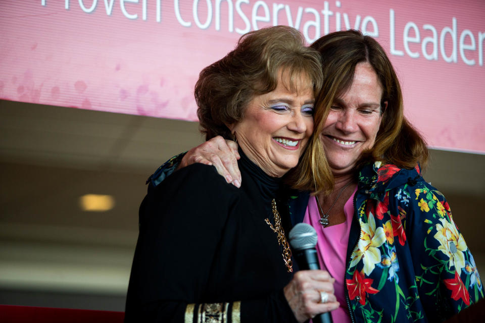 Nancy De Boer (left) and State Rep. Mary Whiteford, R-Casco Township (right), embrace as De Boer is introduced during the formal launch of her campaign Monday, March 21, 2022, at the Holland Civic Center in downtown Holland.