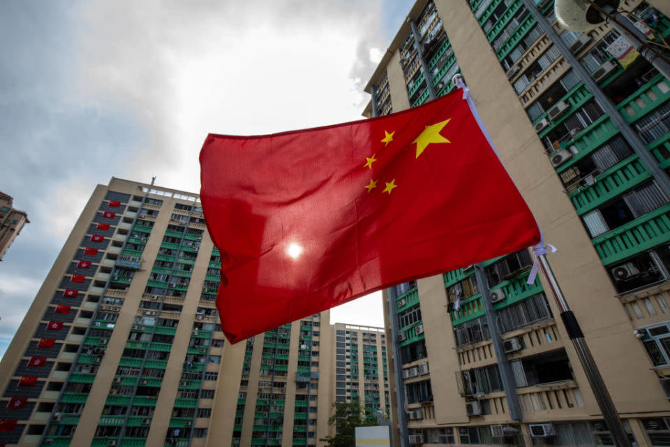 A Chinese flag flies at a public housing estate to mark the 25th anniversary of Hong Kong's return to Chinese rule in Hong Kong on Wednesday, June 22, 2022.<span class="copyright">Paul Yeung—Bloomberg/Getty Images</span>