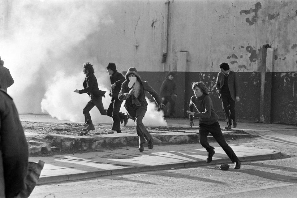 In this photo taken on March 2, 1972, in Londonderry, young Catholic rioters hurl projectiles at British soldiers during a rally protesting the January 30 "Bloody Sunday" killing by British paratroopers of 13 Catholics civil rights marchers in Londonderry.