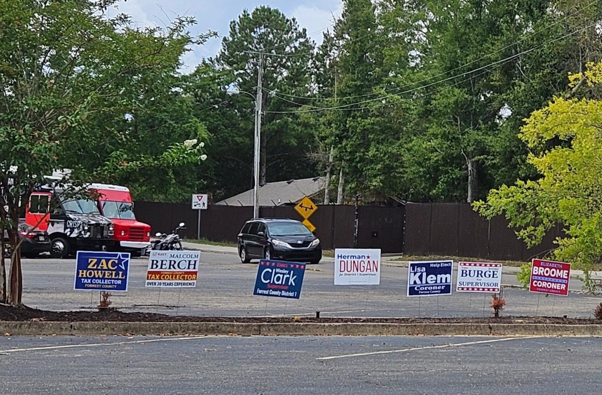Campaign signs outside a polling place in Hattiesburg remind voters to cast their ballots Tuesday for the Mississippi Republican and Democratic primary elections.