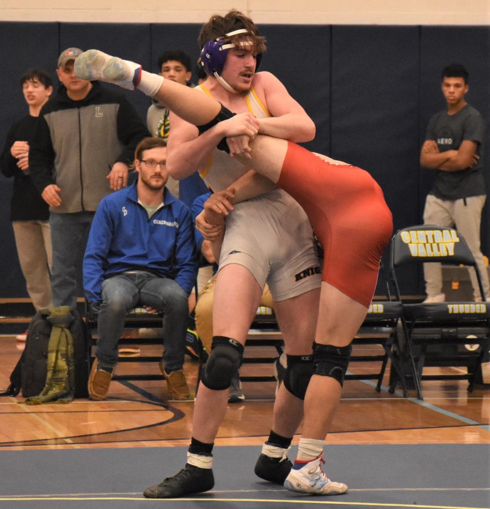 Holland Patent Golden Knight Jordan Koenig works on the leg of Lowville Academy's Sean Kelly during the 172-pound final at Central Valley Academy's Leo J. Sammon Memorial Tournament.