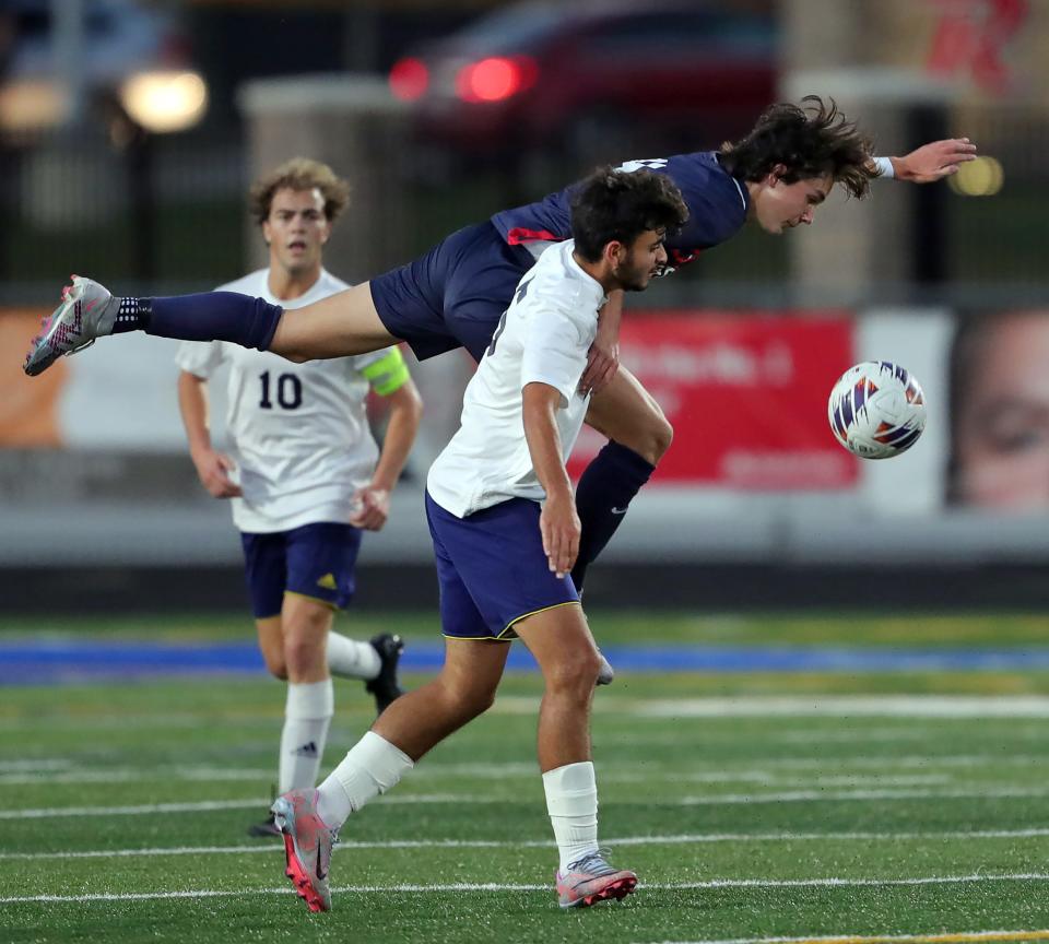 Revere's Joe Brown, top, makes a play for the ball over Copley's Mohammed Alghefari during the first half Tuesday at Revere.