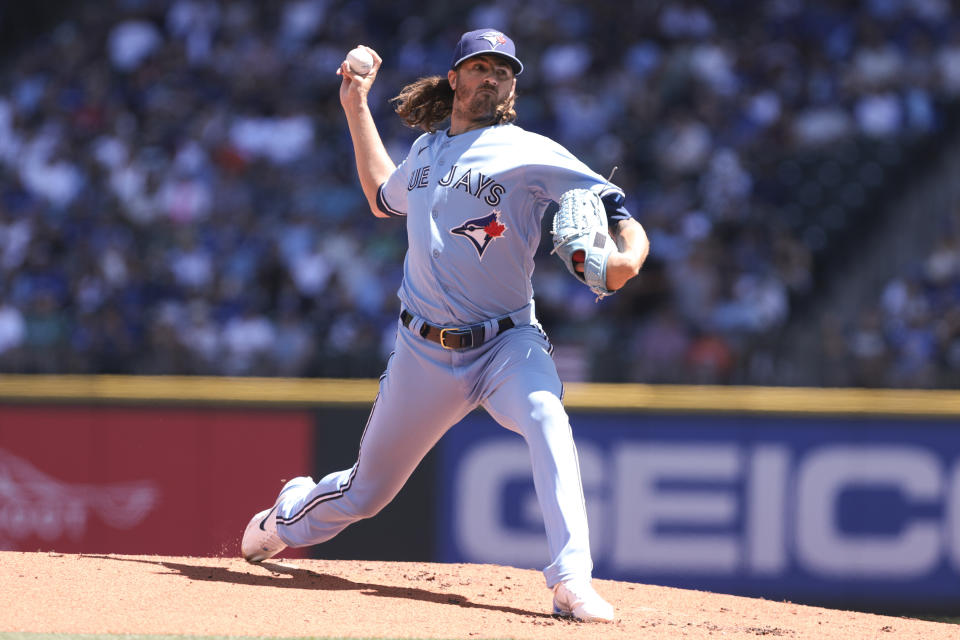 Toronto Blue Jays starting pitcher Kevin Gausman throws against the Seattle Mariners during the first inning of a baseball game, Saturday, July 22, 2023, in Seattle. (AP Photo/Jason Redmond)