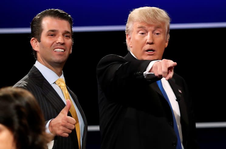 Donald Trump Jr. (L) gives a thumbs up beside his father Donald Trump (R) in Hempstead, New York, U.S. September 26, 2016. REUTERS/Mike Segar