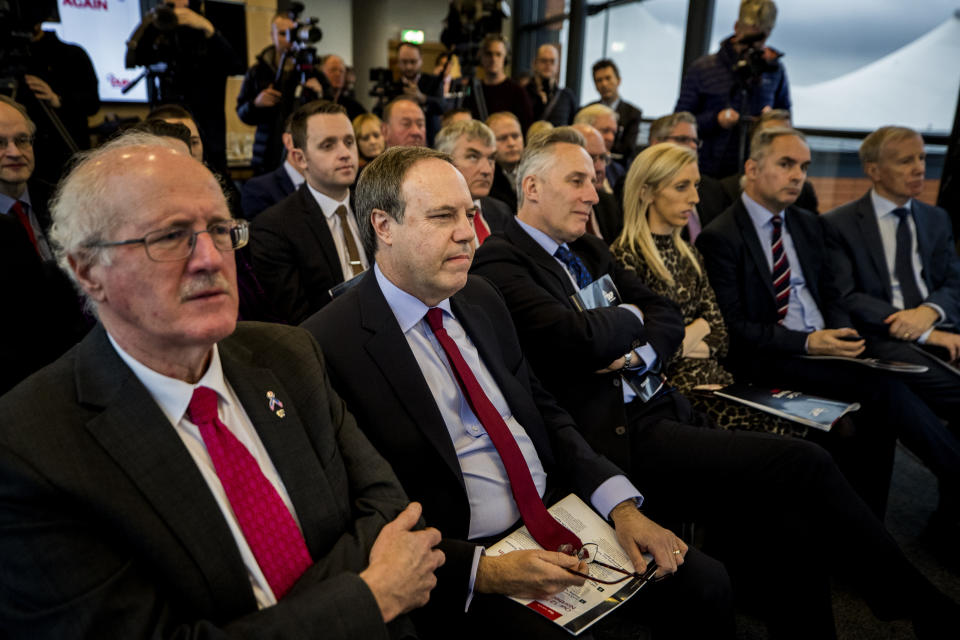 DUP's Nigel Dodds (second left) with party candidates for the upcoming General Election listen to party leader Arlene Foster speaking during the launch of a new policy plan at W5 in Belfast. PA Photo. Picture date: Tuesday November 19, 2019. See PA story POLITICS Election . Photo credit should read: Liam McBurney/PA Wire