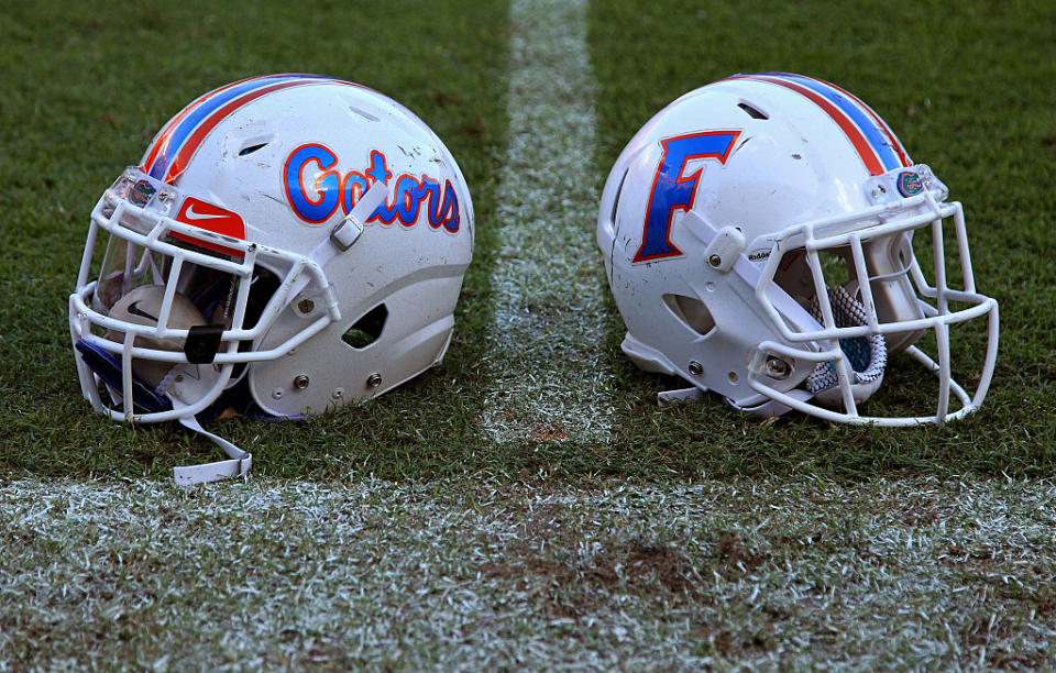 GAINESVILLE, FL - Florida Gators helmets sit on the field. (Getty Images)