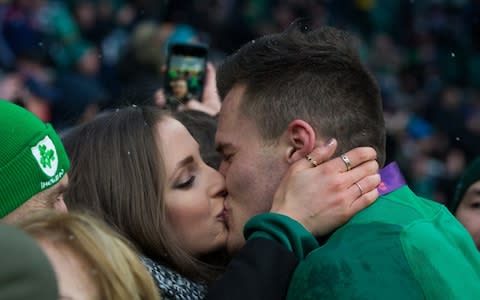 Jacob Stockdale of Ireland gets a celebratory kiss from girlfriend Jessica Gardiner - Credit: Getty Images