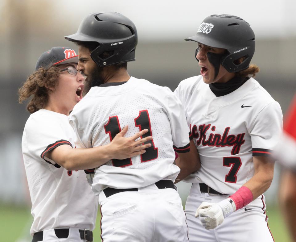 McKinley's Nik Hilton celebrates an infield home run in the sixth inning against Canton South at Munson Stadium, Friday , April 21, 2023.