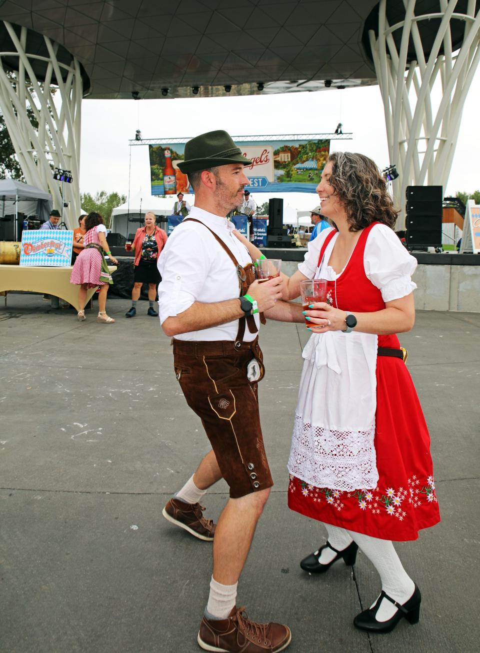 Sarah Mayberry and Rob Parker dance to polka music during the 19th Annual Oktoberfest at the Lauridsen Amphitheater in Water Works Park, 2551 George Flagg Parkway, in Des Moines on Sept. 22, 2023.