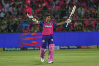 Rajasthan Royals' Yashasvi Jaiswal raises his bat as he celebrates after scoring a century during the Indian Premier League cricket match between Mumbai Indians and Rajasthan Royals in Jaipur, India, Monday, April 22, 2024. (AP Photo/Surjeet Yadav)