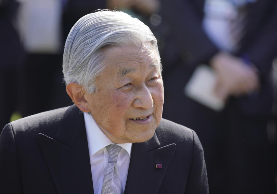 FILE - In this Wednesday, April 25, 2018 file photo, Japan's Emperor Akihito greets the guests during the spring garden party at the Akasaka Palace imperial garden in Tokyo. Japan's Emperor Akihito, marking his 85th birthday — his last before his upcoming abdication — said he feels relieved that his reign is coming to an end without having seen his country at war and that it is important to keep telling younger people about his nation's wartime history, it was reported on Saturday, Dec. 22, 2018. (AP Photo/Eugene Hoshiko, File)
