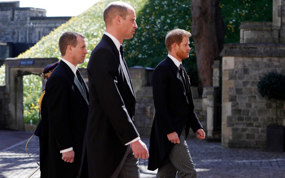 Peter Phillips walks between princes William and Harry at the Duke of Edinburgh's funeral in April - Alastair Grant/WPA Pool/ Getty Images