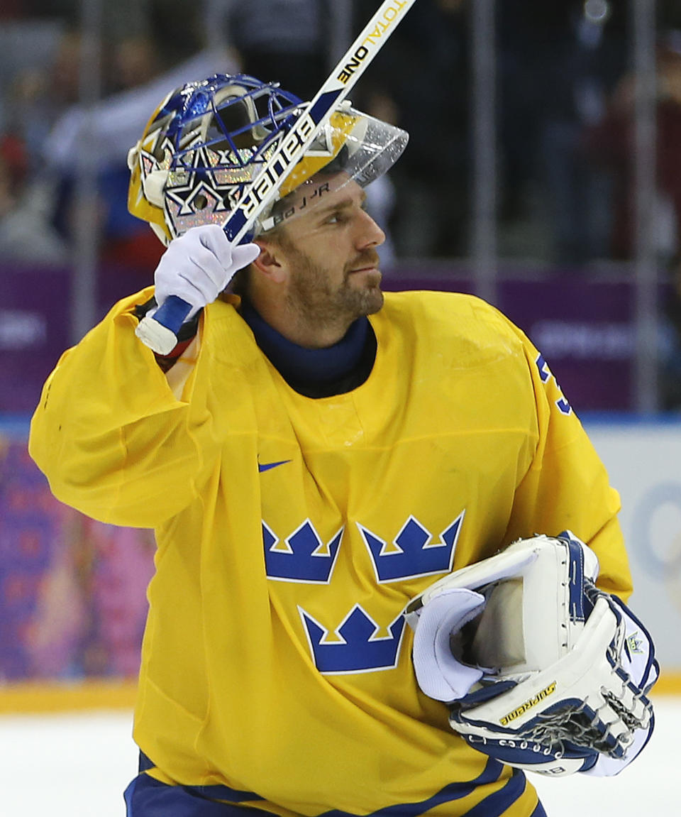 Sweden goaltender Henrik Lundqvist waves to hockey fans after shutting out Switzerland 1-0 in a men's ice hockey game at the 2014 Winter Olympics, Friday, Feb. 14, 2014, in Sochi, Russia. (AP Photo/Mark Humphrey)