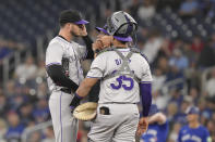 Colorado Rockies pitcher Dakota Hudson reacts during a mound visit in the first inning of a baseball game against Toronto Blue Jays in Toronto, Saturday, April 13, 2024. (Chris Young/The Canadian Press via AP)
