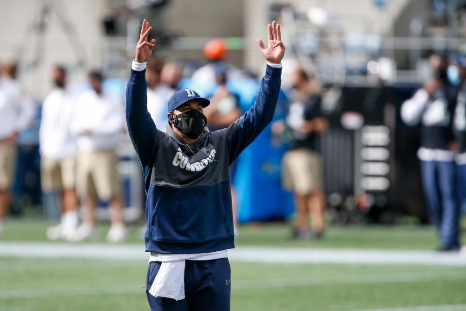 Dallas Cowboys quarterback Dak Prescott (4) reacts during a pregame warmup drill against the Seattle Seahawks at CenturyLink Field.