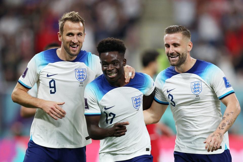 Bukayo Saka of England celebrates with teammates Harry Kane and Luke Shaw after scoring their team’s fourth goal (The FA via Getty Images)