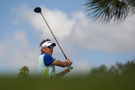 Mar 2, 2015; Palm Beach Gardens, FL, USA; Ian Poulter tees off on the 18th hole during the final round of the Honda Classic at PGA National GC Champion Course. Mandatory Credit: Peter Casey-USA TODAY Sports