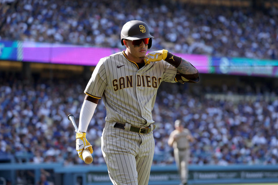 LOS ANGELES, CALIFORNIA - AUGUST 07: Manny Machado #13 of the San Diego Padres reacts after his strikeout during the fourth inning at Dodger Stadium on August 07, 2022 in Los Angeles, California. (Photo by Harry How/Getty Images)