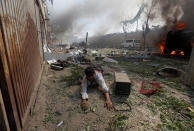 <p>A wounded man lies on the ground at the site of a blast in Kabul, Afghanistan May 31, 2017. (Omar Sobhani/Reuters) </p>
