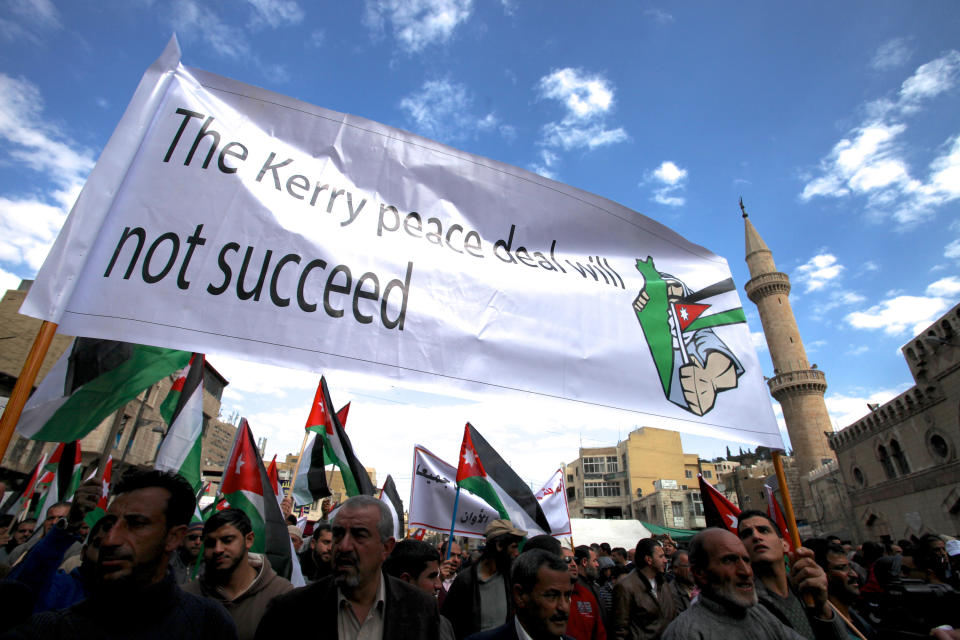 Protesters affiliated with Jordan's Muslim Brotherhood chant anti-Israel and anti-America slogans during a demonstration in downtown Amman, Jordan, Friday, Feb. 14, 2014. Hours before Jordan's King Abdullah II met with U.S. President Barack Obama in California, his Islamist opposition at home has staged its largest protest in several months to reject a peaceful Mideast settlement. (AP Photo/Mohammad Hannon)