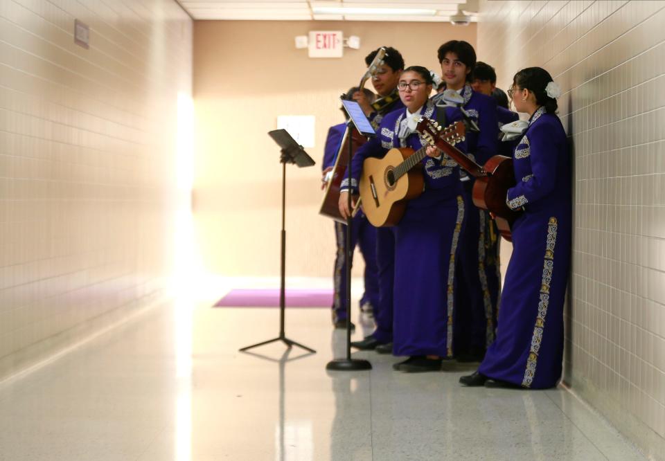 Members of the Mariachi Reyes del Oeste get ready to perform.