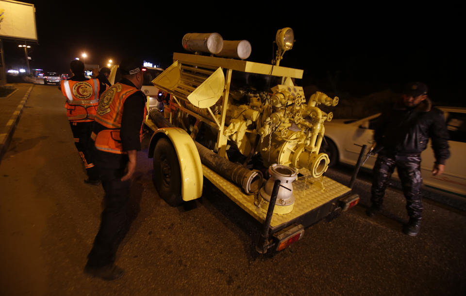 Rescue vehicles, part of a convoy of around 20, arrives in Gaza City, Tuesday, Dec. 17, 2019. Palestinian officials say Israel has allowed the import of around 20 rescue and firefighting vehicles. The equipment was donated by Qatar. (AP Photo/Hatem Moussa)