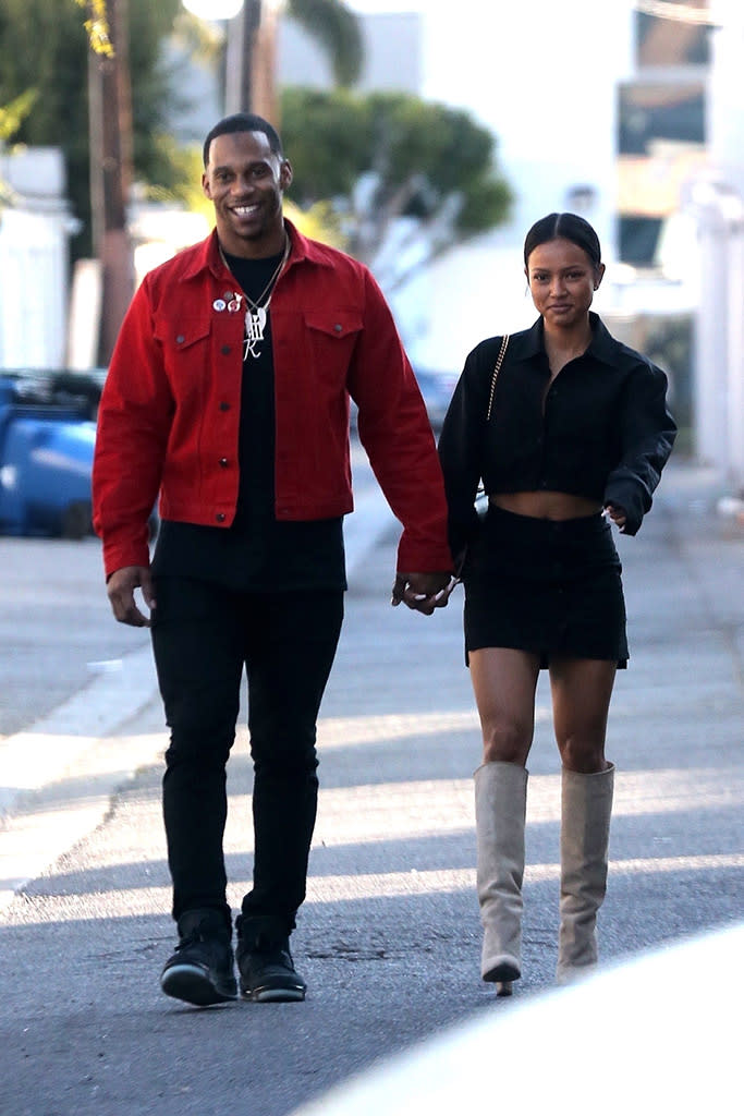 <p>New-couple alert! Chris Brown’s ex and the former NFL wide receiver confirmed rumors they are a thing on Saturday, when they were spotted holding hands while lunching in Hollywood. Whispers that the two are romantically involved began last month, when they were seen catching a movie together over the Thanksgiving holiday. (Photo: Backgrid) </p>
