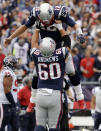 <p>New England Patriots quarterback Tom Brady (12) gets a lift from center David Andrews after throwing a touchdown pass to Rob Gronkowski during the first half of an NFL football game against the Houston Texans, Sunday, Sept. 9, 2018, in Foxborough, Mass. (AP Photo/Charles Krupa) </p>