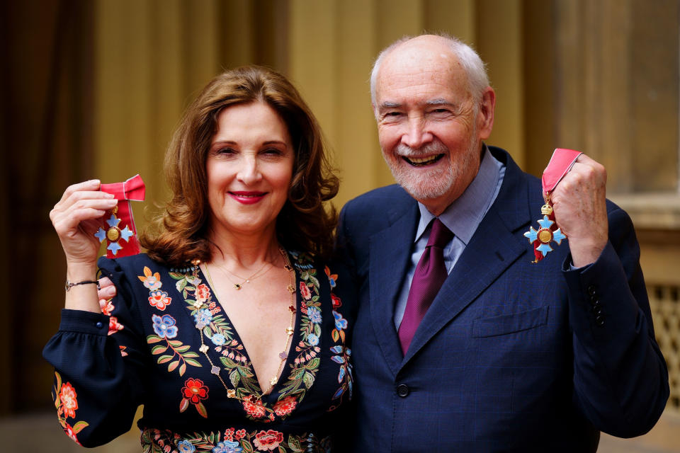LONDON, ENGLAND - JUNE 24: Professor Michael Wilson and Producer of the James Bond series of films, Barbara Broccoli pose with their CBE (Commander of the Order of the British Empire) medals for services to film and drama, following an investiture ceremony at Buckingham Palace on June 24, 2022 in London, England. (Photo by Victoria Jones-Pool/Getty Images)