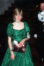 <p>Princess Diana attended a charity concert at the Barbican in a green gown by Graham Wren which she accessorized with <a href="https://www.townandcountrymag.com/style/jewelry-and-watches/g20682652/princess-diana-jewelry-collection/" rel="nofollow noopener" target="_blank" data-ylk="slk:an emerald and diamond choker." class="link ">an emerald and diamond choker.</a></p>