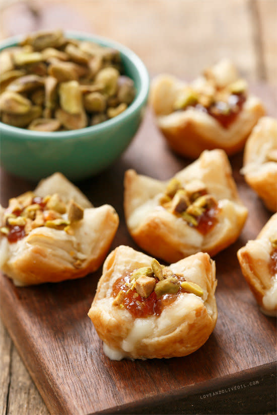 <strong>Get the <a href="http://www.loveandoliveoil.com/2013/12/baked-brie-puffs-with-fruit-preserves-and-pistachios.html">Baked Brie Puffs with Fruit Preserves recipe</a>&nbsp;from Love &amp; Olive Oil</strong>