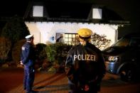 German police officers stand in front of the house believed to belong to the parents of crashed Germanwings flight 4U 9524 co-pilot Andreas Lubitz in Montabaur, March 26, 2015. REUTERS/Kai Pfaffenbach