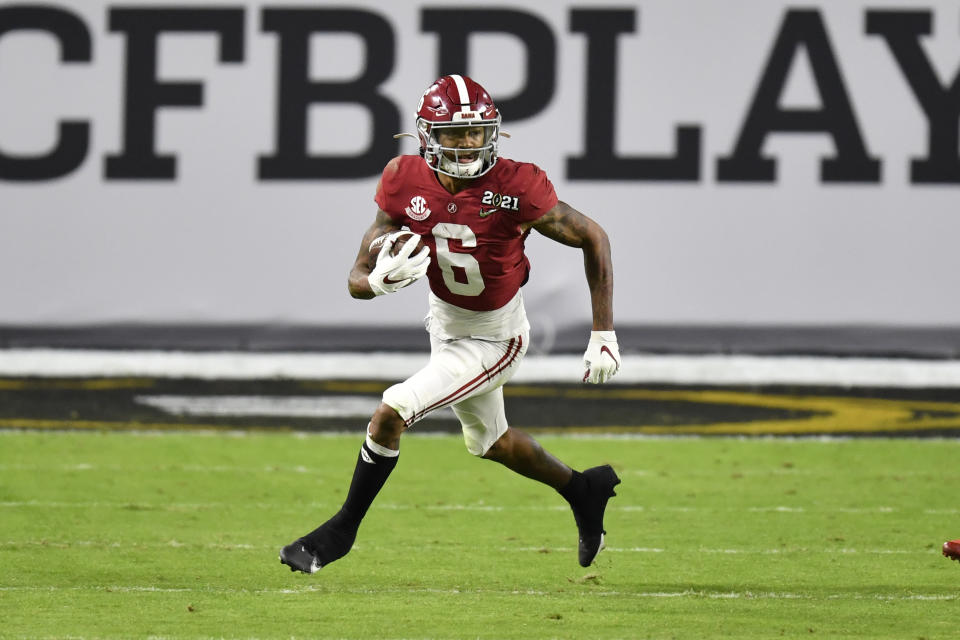 MIAMI GARDENS, FLORIDA - JANUARY 11: DeVonta Smith #6 of the Alabama Crimson Tide runs with the ball during the College Football Playoff National Championship football game against the Ohio State Buckeyes at Hard Rock Stadium on January 11, 2021 in Miami Gardens, Florida. The Alabama Crimson Tide defeated the Ohio State Buckeyes 52-24. (Photo by Alika Jenner/Getty Images)