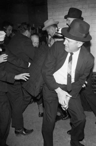Police tackle Jack Ruby after the nightclub owner shot alleged John F. Kennedy assassin Lee Harvey Oswald in the basement of the Dallas police station on November 24, 1963. On January 3, 1967, Ruby died of cancer in Dallas. Photo by Frank Johnston/UPI