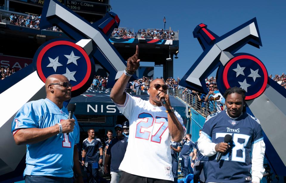 Former Houston Oilers quarterback Warren Moon, former Oilers and Titans running back Eddie George and former Titans running back Chris Johnson get the crowd hyped up for the Tennessee Titans game against the Indianapolis Colts at Nissan Stadium Sunday, Oct. 23, 2022, in Nashville, Tenn. The Titans held a homecoming celebration for former Oilers and Titans players over the weekend. 