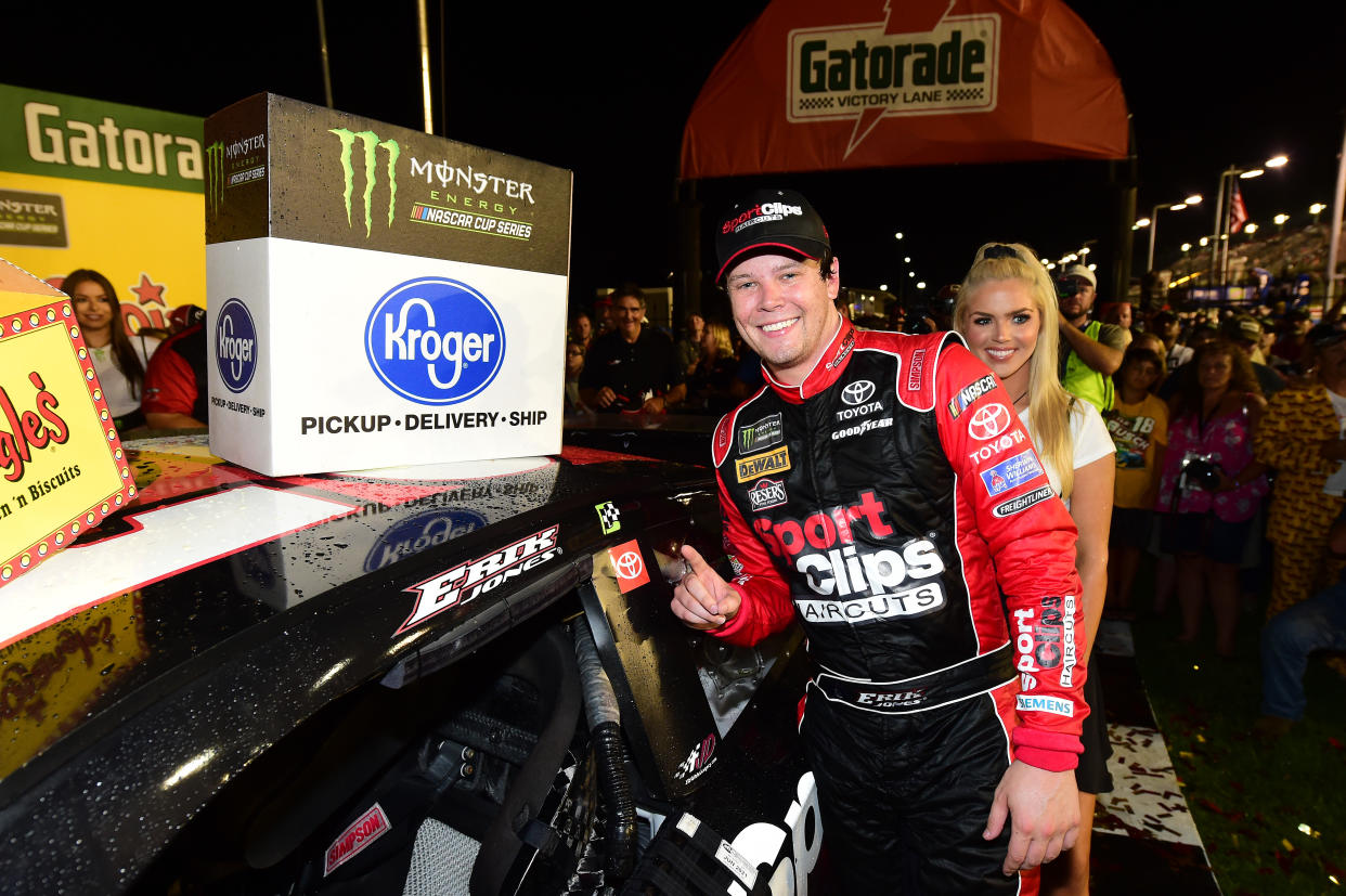 DARLINGTON, SOUTH CAROLINA - SEPTEMBER 02: Erik Jones, driver of the #20 Sport Clips Throwback Toyota, poses with the winner's decal on his car in Victory Lane after winning the Monster Energy NASCAR Cup Series Bojangles' Southern 500 at Darlington Raceway on September 02, 2019 in Darlington, South Carolina. (Photo by Jared C. Tilton/Getty Images)