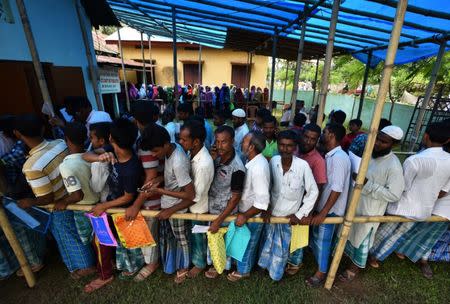 People wait in queue to check their names on the draft list at the National Register of Citizens (NRC) centre at a village in Nagaon district, Assam state, July 30, 2018. REUTERS/Stringer